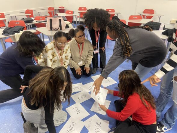3 young smiling girls posting for a photo